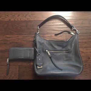 Marc Jacobs hobo bag and accordion zip wallet.